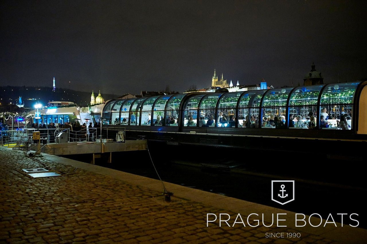 The exterior of the boat, with the city in the background