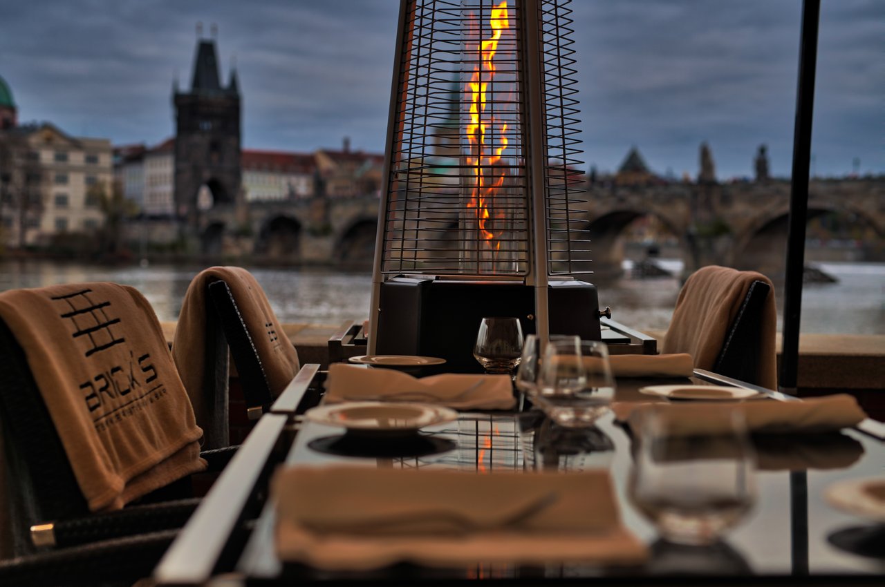A small fire next to an outdoor table