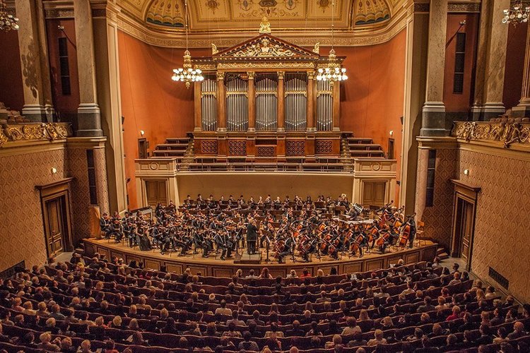 A large hall with a grand organ