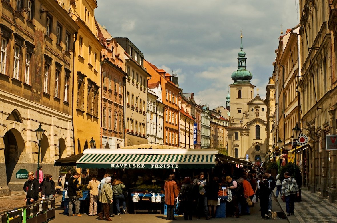 an old street market, surrounded by yellow buildings