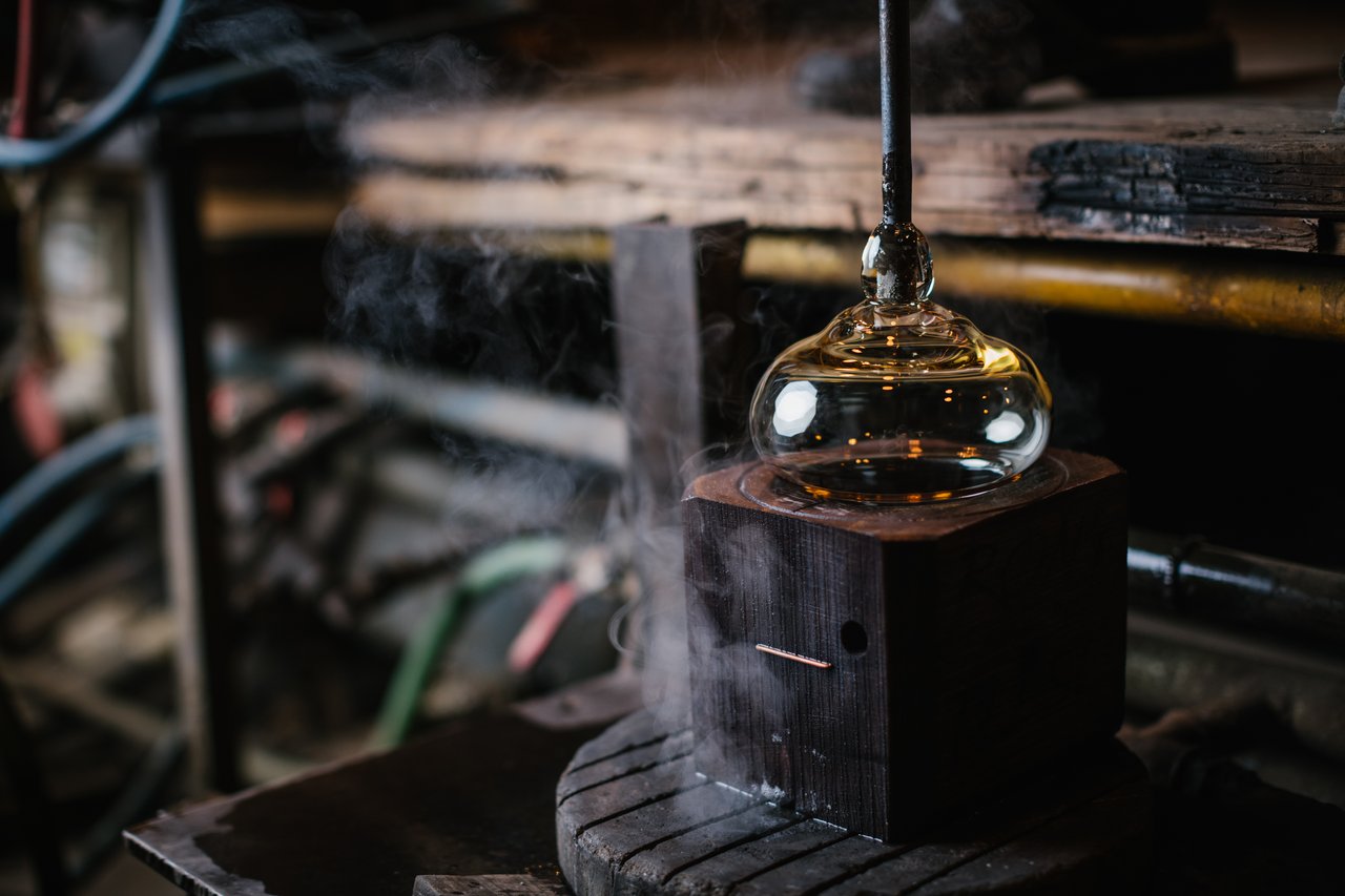 A type of glass that is shaped using wooden tools to achieve the desired shape